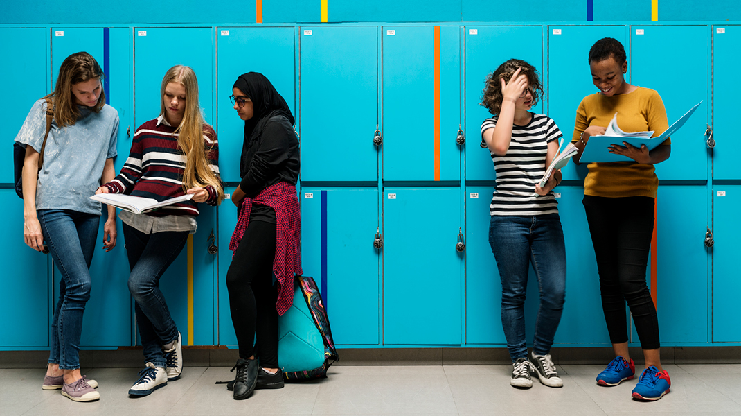 OCPS High School Renovation Projects high school students standing by lockers